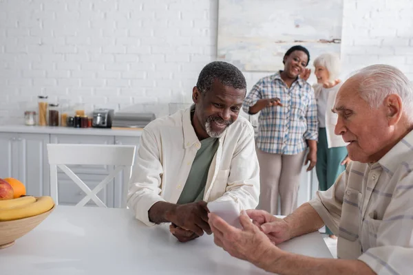 Senior Man Using Smartphone Smiling African American Friend Nursing Home — Stock Photo, Image