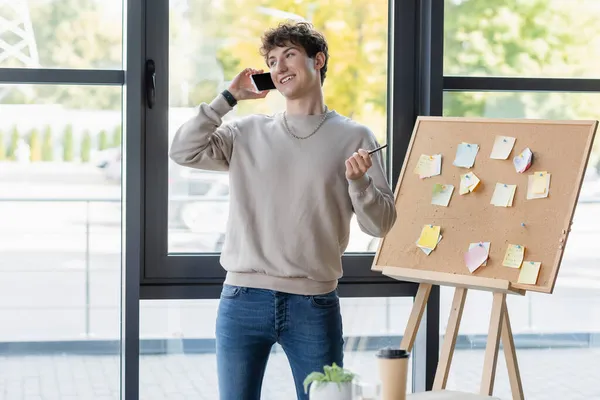 Young Businessman Talking Smartphone Board Sticky Notes Office — Stock Photo, Image