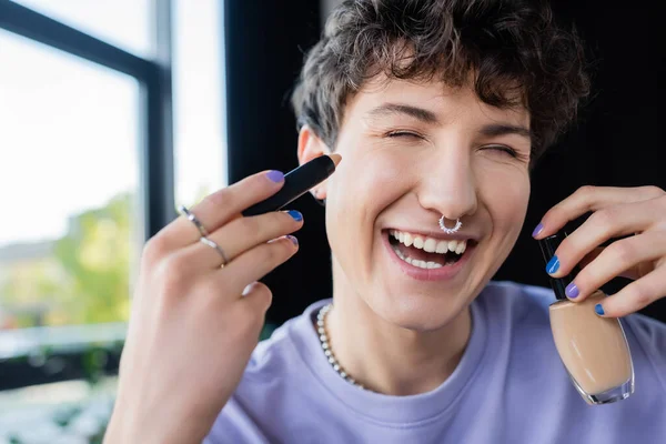 Smiling Transgender Person Holding Concealer Face Foundation — Stock Photo, Image