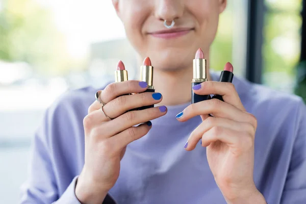 Cropped View Lipsticks Hands Smiling Transgender Person — Stock Photo, Image