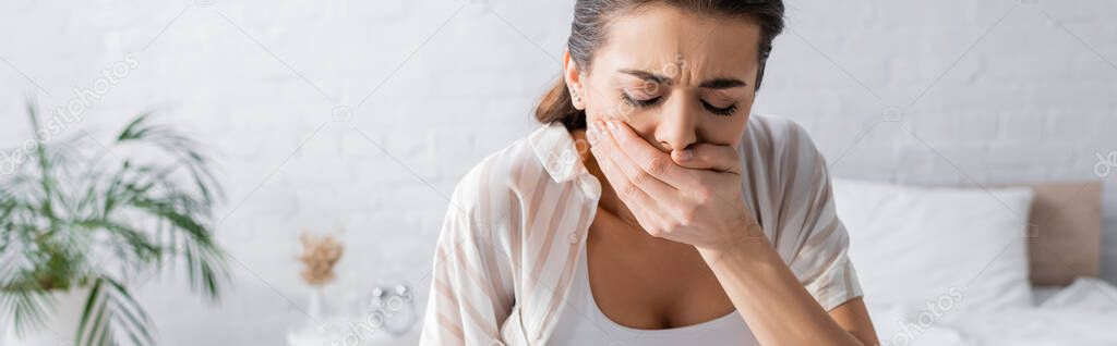 young pregnant woman feeling nausea and covering mouth, banner