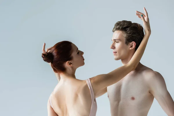 Ballerina Looking Shirtless Partner While Performing Dance Isolated Grey — Stock Photo, Image