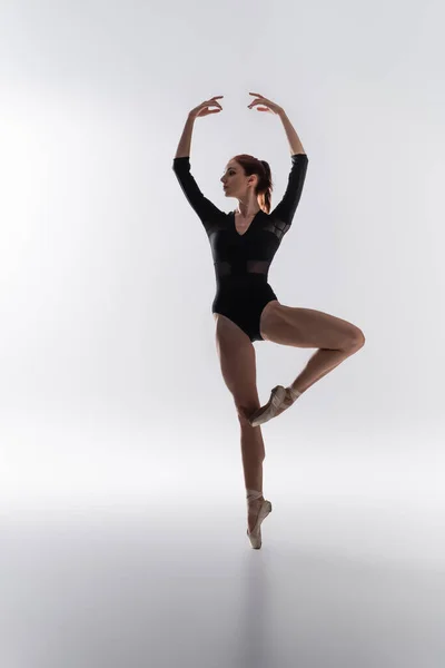 Full Length Elegant Ballerina Bodysuit Performing Dance Raised Hands Grey — Stock Photo, Image