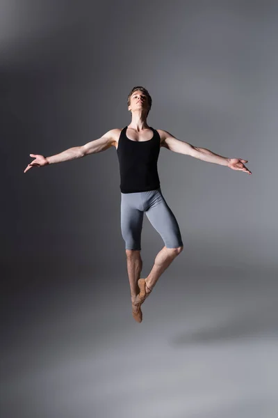 Full Length Elegant Ballet Dancer Performing Levitating Outstretched Hands Dark — Stock Photo, Image