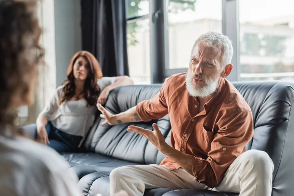 Displeased Man Pointing Upset Wife While Talking Blurred African American — Stock Photo, Image