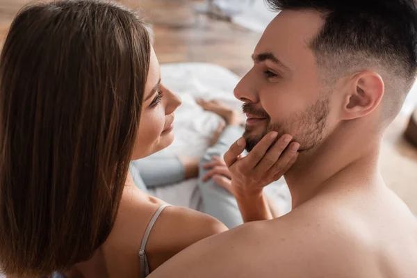 Young Tender Woman Touching Face Young Smiling Man Bedroom — стоковое фото