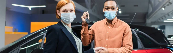 Car Dealer African American Buyer Medical Masks Shaking Hands While — Stockfoto