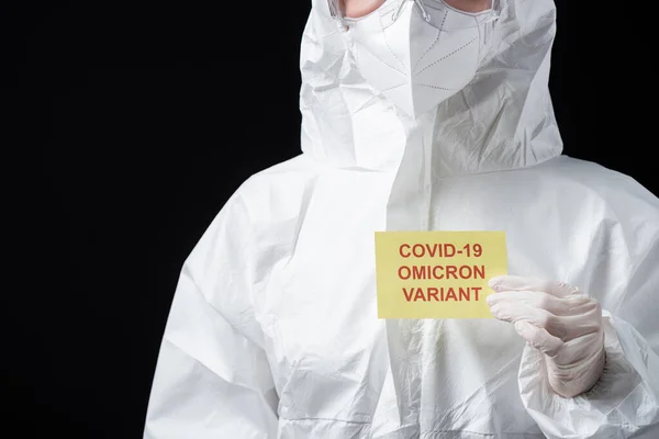 Partial View Doctor Hazmat Suit Holding Card Covid Omicron Variant — Stock Photo, Image