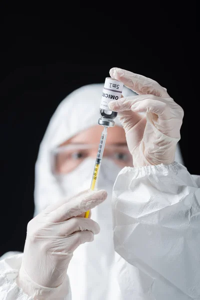 Blurred Immunologist Hazmat Suit Holding Syringe Omicron Variant Vaccine Isolated — Fotografie, imagine de stoc