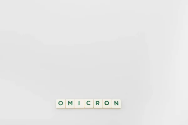 Top View White Cubes Omicron Lettering Grey Background Copy Space — Stock Photo, Image