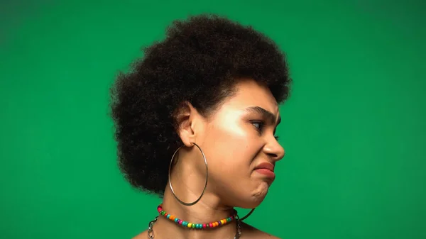 Displeased African American Woman Looking Away Isolated Green — Fotografia de Stock