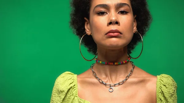 Dissatisfied African American Woman Hoop Earrings Looking Camera Isolated Green — Foto Stock