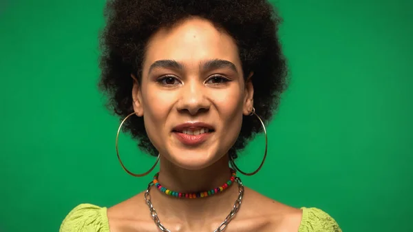 Joyful African American Woman Hoop Earrings Looking Camera Isolated Green — Stockfoto