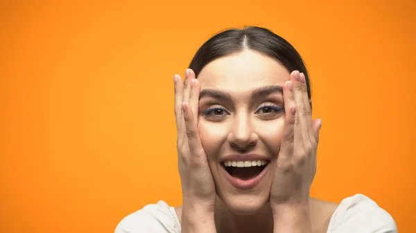 Cheerful Woman Looking Camera Isolated Orange — стоковое фото