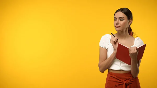 Young Woman Holding Notebook Pen Isolated Yellow — Foto de Stock