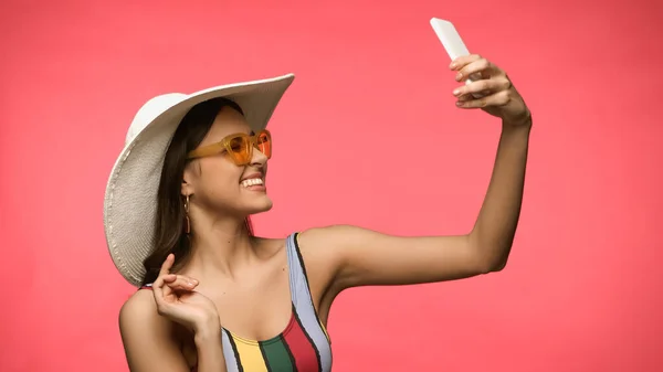 Happy Woman Sun Hat Taking Selfie Smartphone Isolated Pink — Fotografie, imagine de stoc
