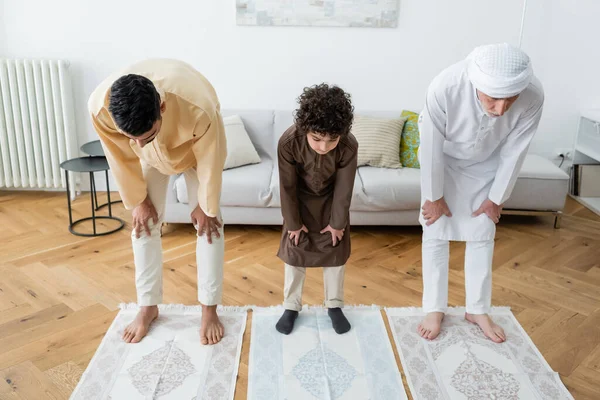 Interracial Barefoot Men Muslim Kid Standing Rugs Home — Stock Photo, Image