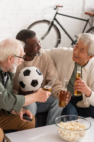 Positive Interracial Friends Holding Beer Football Home — Stock Photo, Image