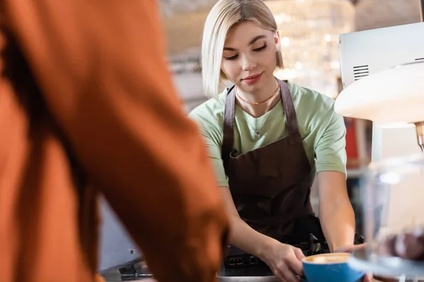 Young Barista Holding Cup Coffee Blurred Customer Cafe — Stock Photo, Image