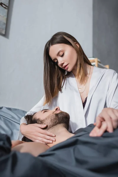Young Woman Looking Bearded Boyfriend Robe — Stock Photo, Image