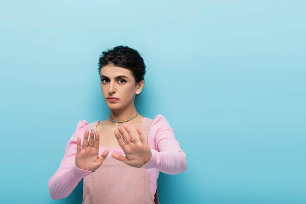 Serious Brunette Woman Looking Camera Showing Stop Gesture Blue Background — Stock Photo, Image