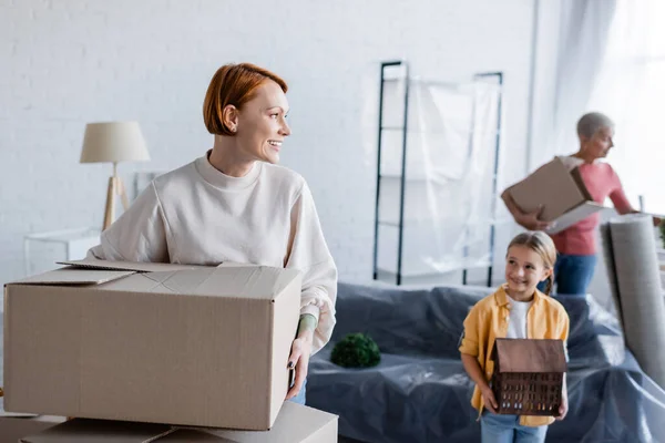 Smiling Woman Holding Carton Package Adopted Daughter House Model — Stock Photo, Image