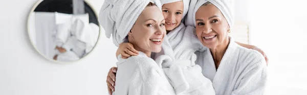 Positive Lesbian Mothers Bathrobes Holding Adopted Daughter Bathroom Banner — Stock Photo, Image