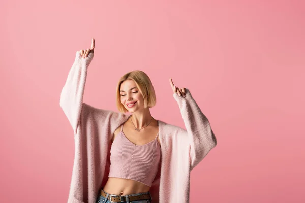 Happy Young Woman Soft Cardigan Pointing Fingers Isolated Pink — Stock Photo, Image