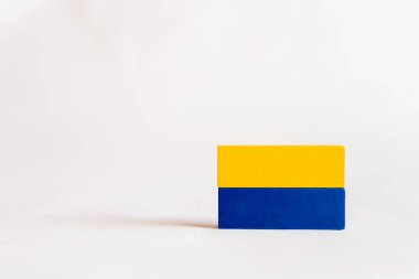 blue and yellow rectangular blocks on white background with copy space, ukrainian concept clipart