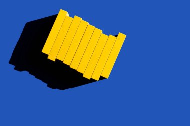 top view of colored yellow blocks on blue background, ukrainian concept clipart