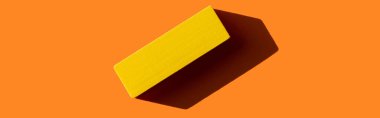 top view of yellow rectangular block on orange background with shadow, banner clipart