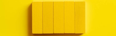 top view of bright rectangular blocks on yellow background, banner clipart