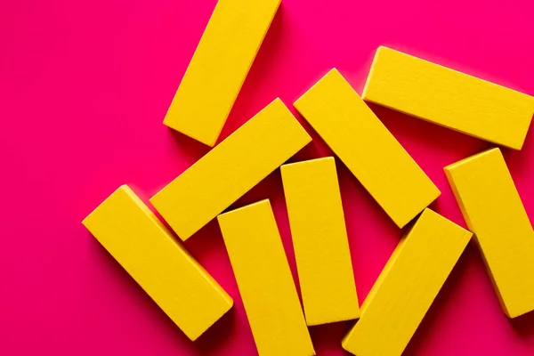 Top View Several Yellow Blocks Bright Pink Background — Stock Photo, Image