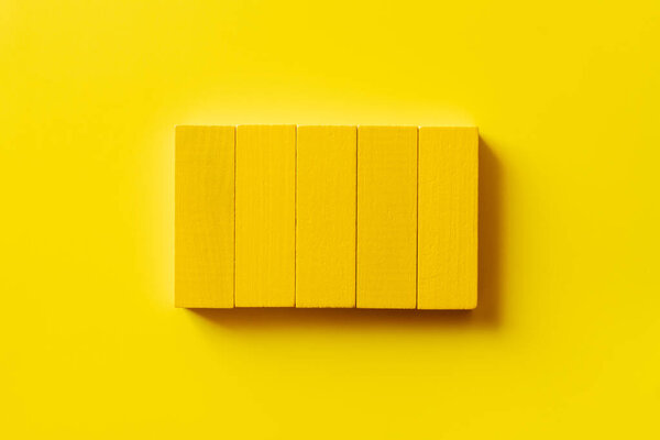 top view of colored rectangular blocks on yellow background