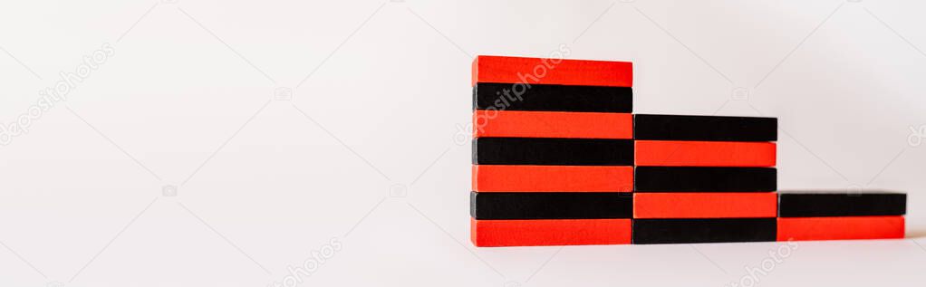 stairs made of red and black blocks on white background with copy space, banner