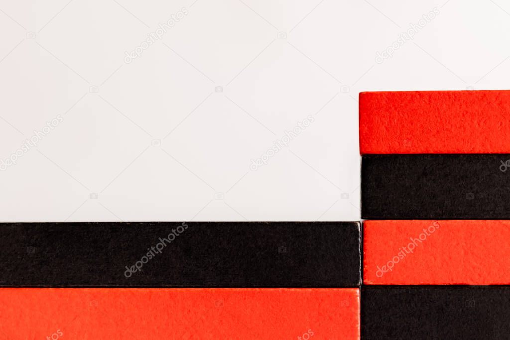 close up view of rectangular red and black blocks isolated on white