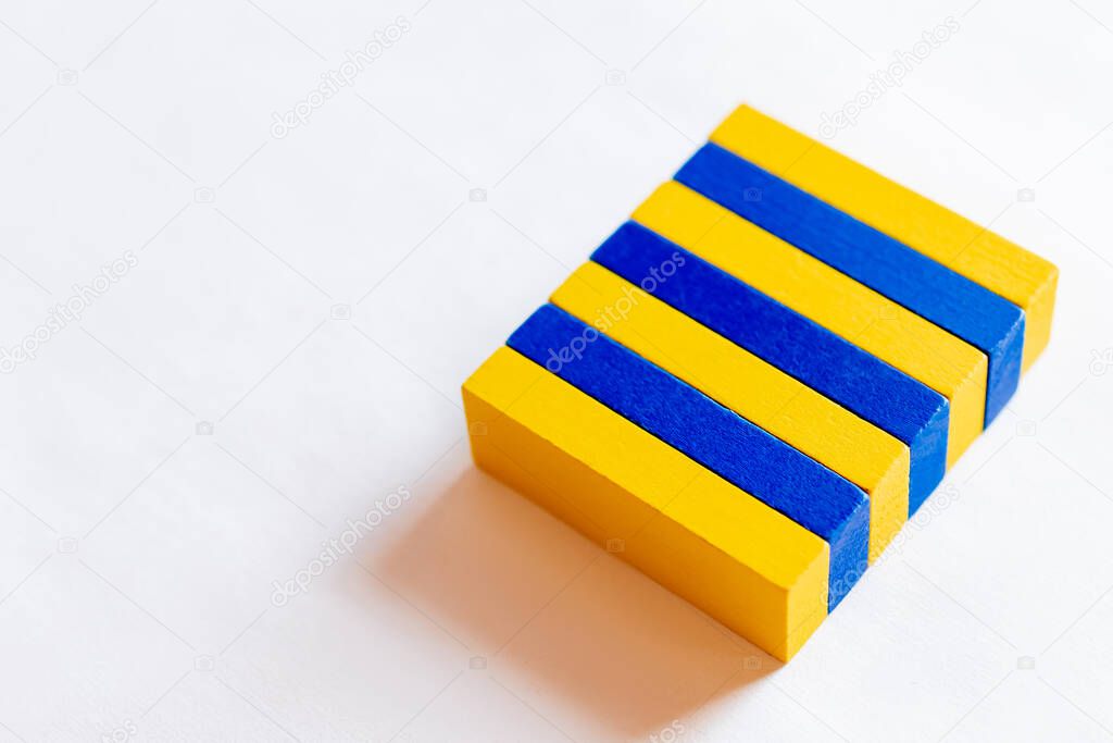 top view of blue and yellow rectangular blocks on white background, ukrainian concept