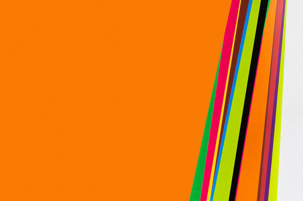 bright background with multicolored stripes and orange copy space