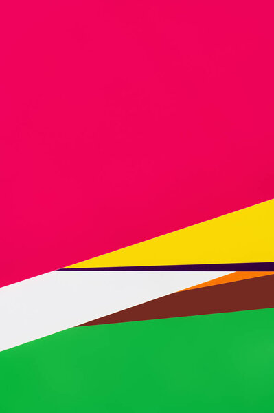 bright pink background with multicolored stripes and copy space