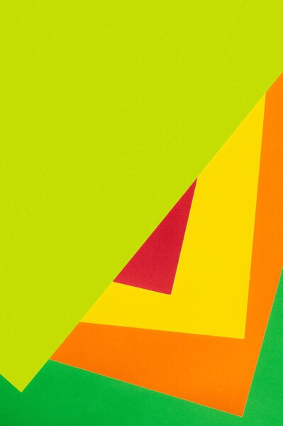 multicolored geometric background with bright green copy space