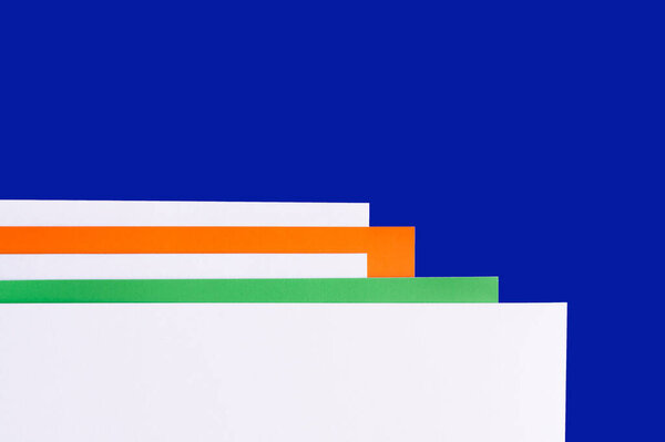 abstract background with multicolored paper and blue copy space