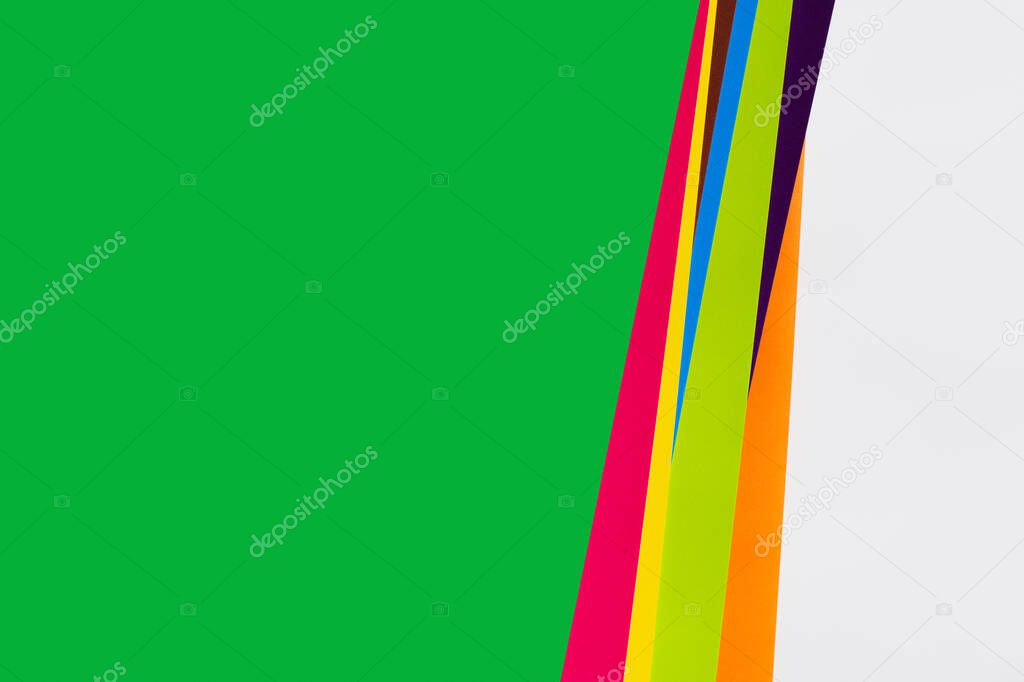 simple geometric background with multicolored stripes and green copy space