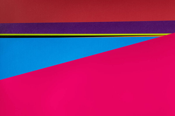 multicolored geometric background with bright pink copy space
