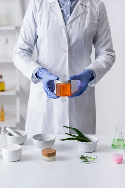 Cropped View Laboratory Assistant Latex Gloves Holding Jar Honey Cosmetic — Stock Photo, Image