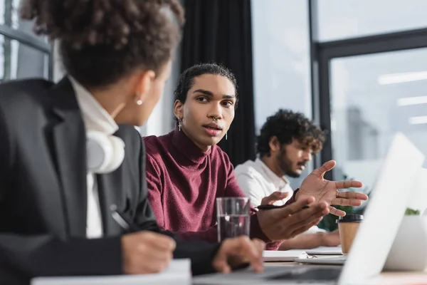 African American Businessman Talking Blurred Colleague Laptop Takeaway Drink Office — Stock Photo, Image