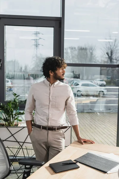 Side View Young Indian Businessman Standing Working Table Office — ストック写真