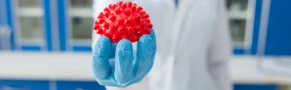 Cropped View Blurred Virologist Holding Red Coronavirus Bacteria Model Banner — Stock Photo, Image