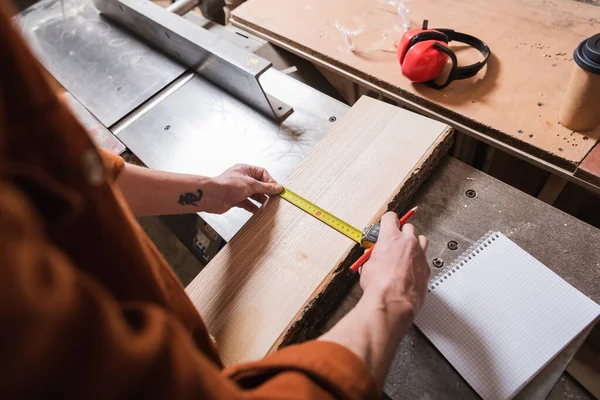 Cropped View Furniture Designer Measuring Wooden Plank Blank Notebook — ストック写真