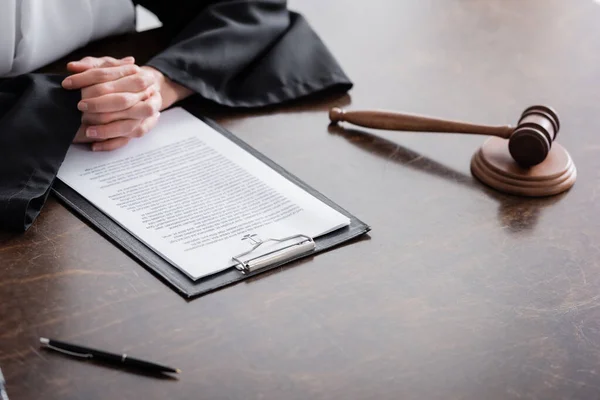 Partial View Prosecutor Clenched Hands Lawsuit Gavel Wooden Desk — Fotografia de Stock