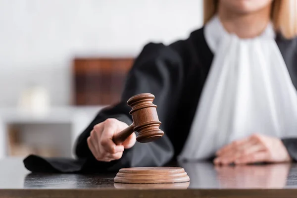 Partial View Blurred Judge Mantle Holding Wooden Gavel — Stock Photo, Image
